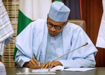 President Muhammadu Buhari signing the bill